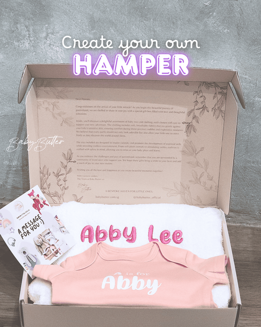 A Baby Butter hamper with a personalised romper inside